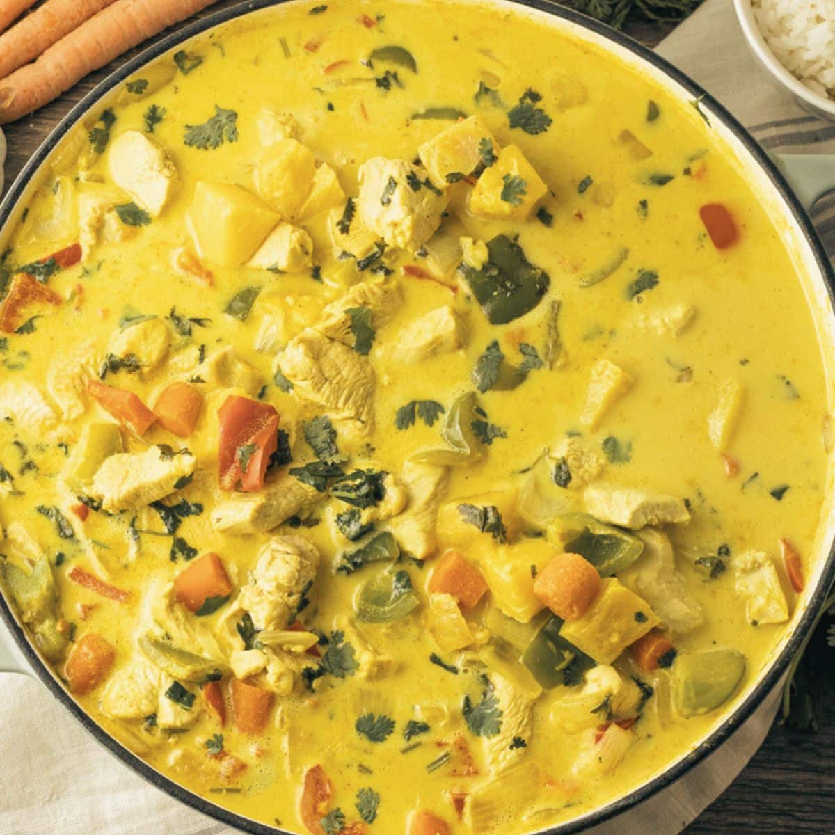 homemade curry with chicken and pineapple in a large skillet