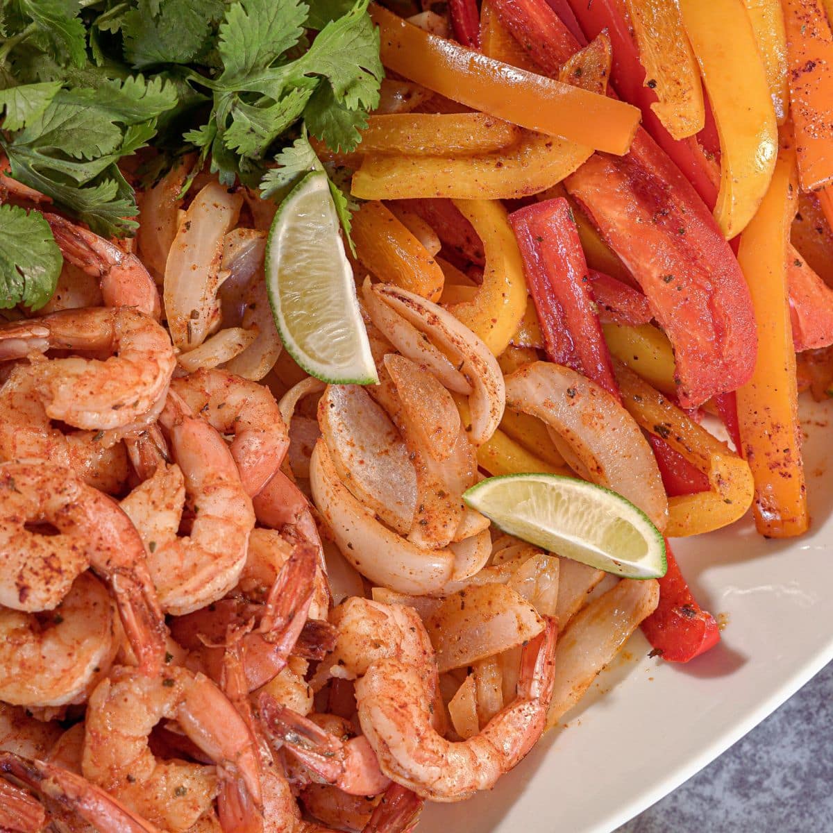 shrimp fajitas with red, orange and yellow peppers