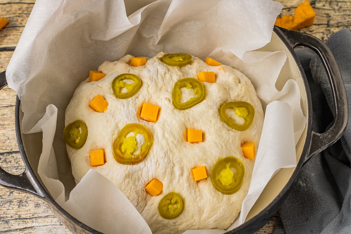 jalapeno and cheddar cheese bread baked in a dutch oven pan