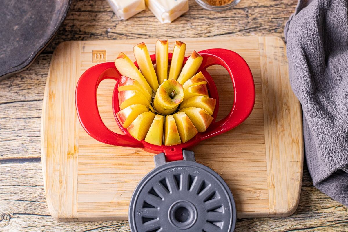 sliced apples in an apple corer 