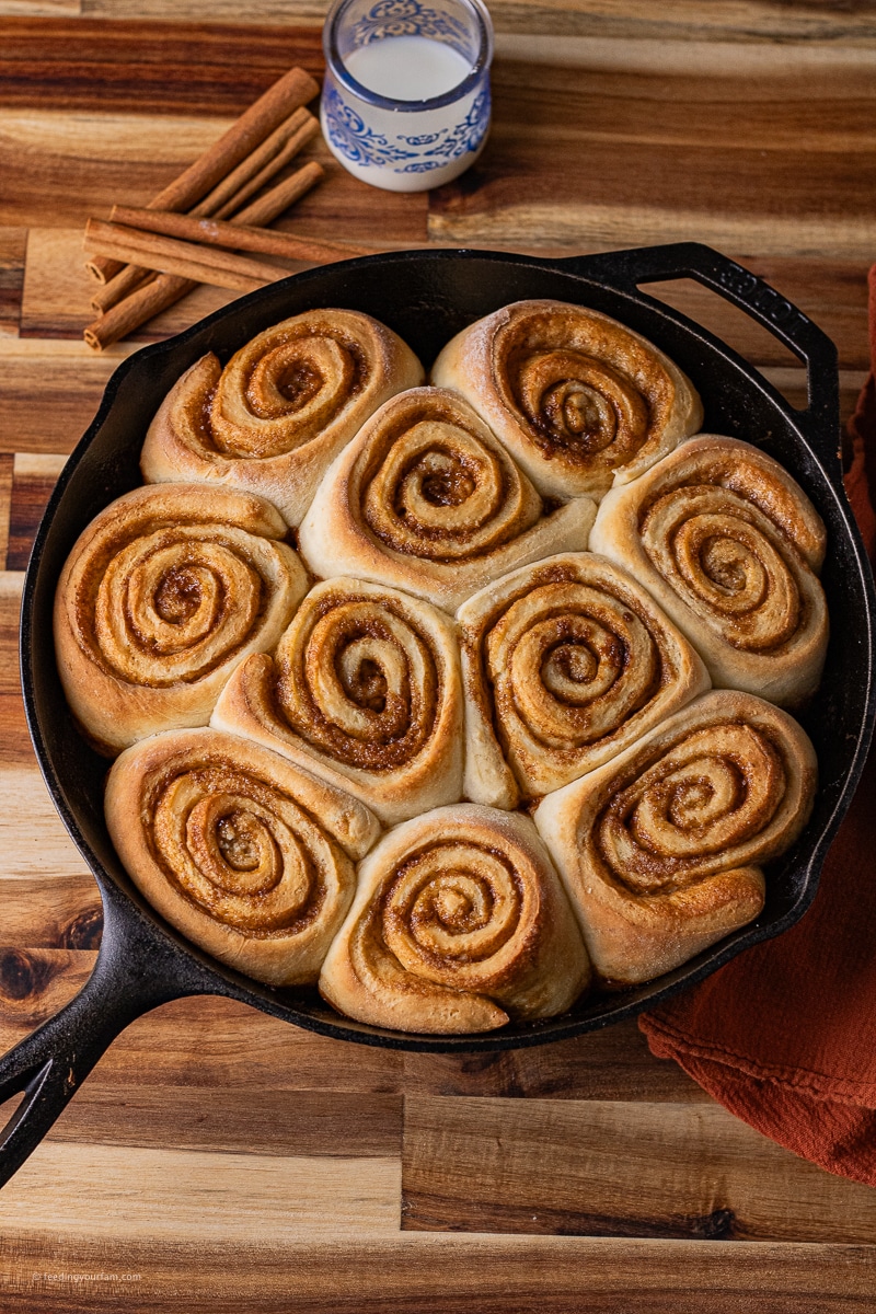 These Cast Iron Cinnamon Rolls are big, soft, fluffy homemade cinnamon rolls baked in a cast iron skillet. They are filled with a classic, buttery cinnamon brown sugar spread and topped with a creamy cream cheese frosting for the best breakfast or brunch the whole fam will love.