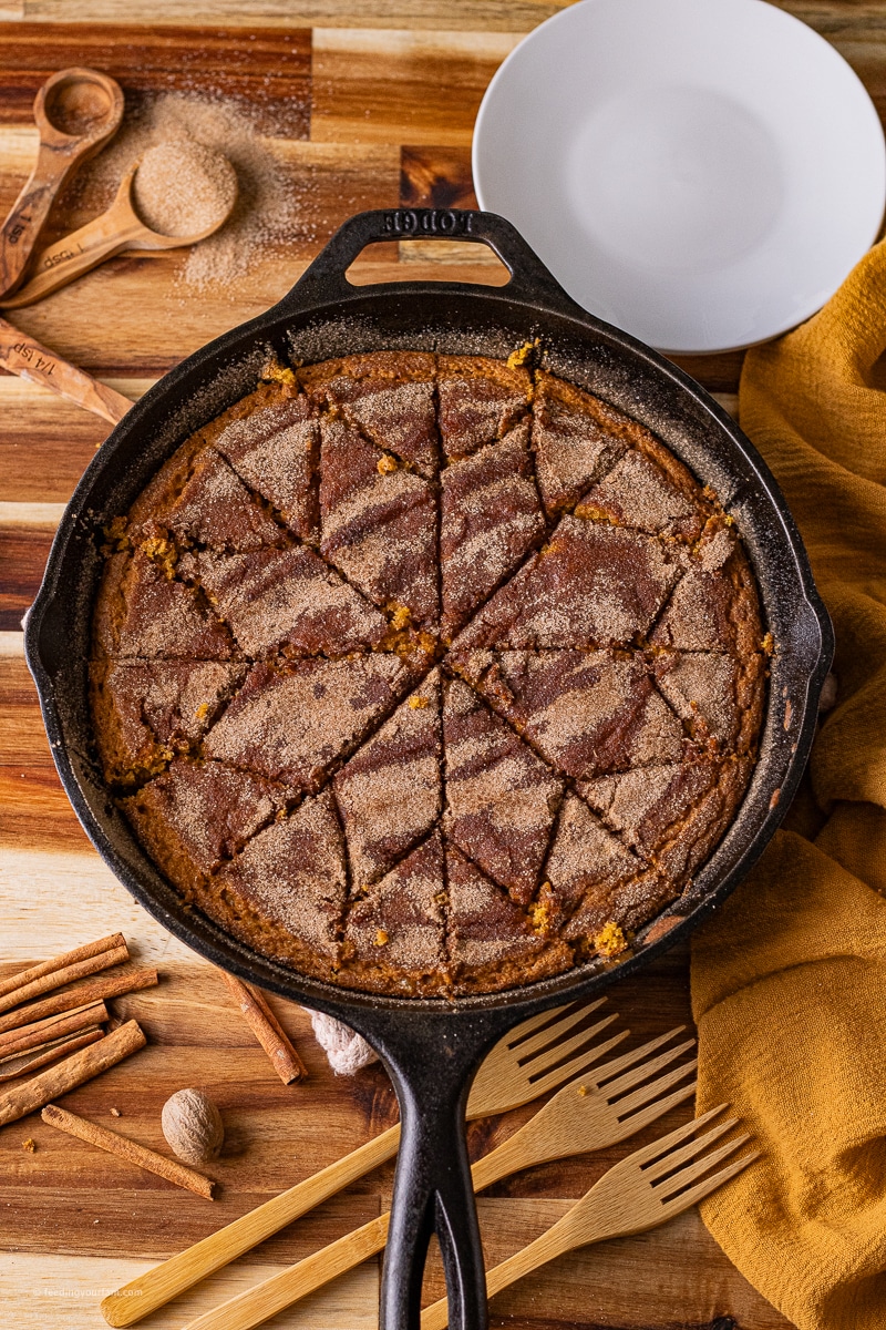 Cast iron pumpkin bread is soft, moist and full of warm pumpkin spice, topped with a cinnamon sugar topping for the perfect fall treat.