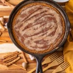 pumpkin bread with cinnamon sugar topping baked in a cast iron skillet