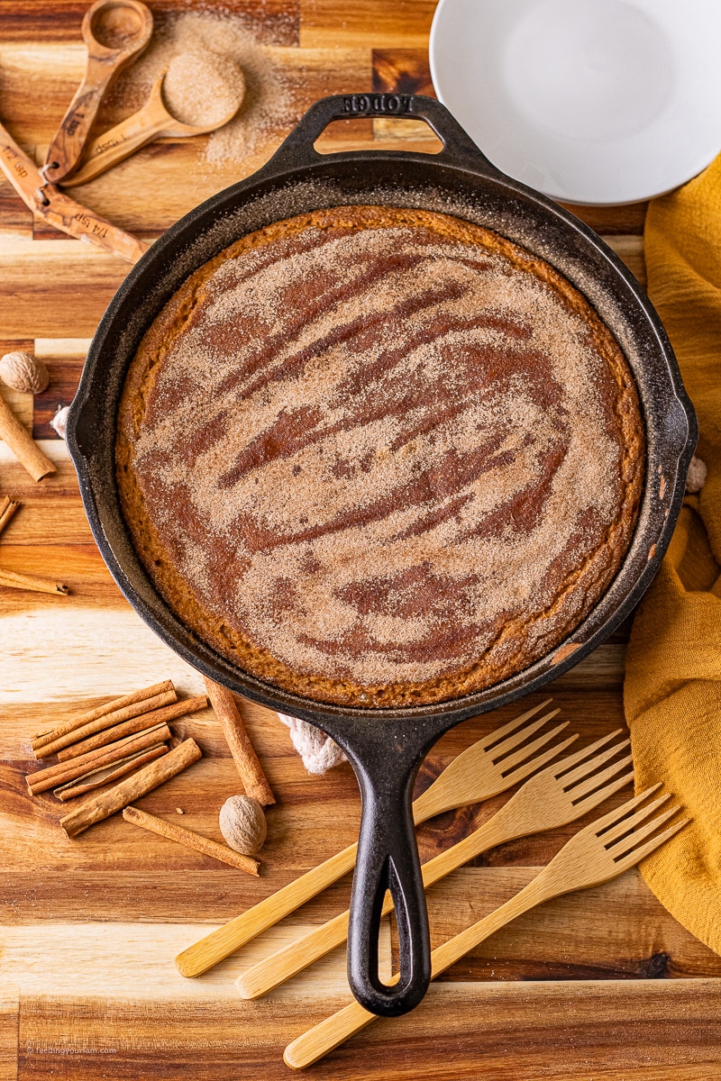 pumpkin bread with cinnamon sugar topping baked in a cast iron skillet 