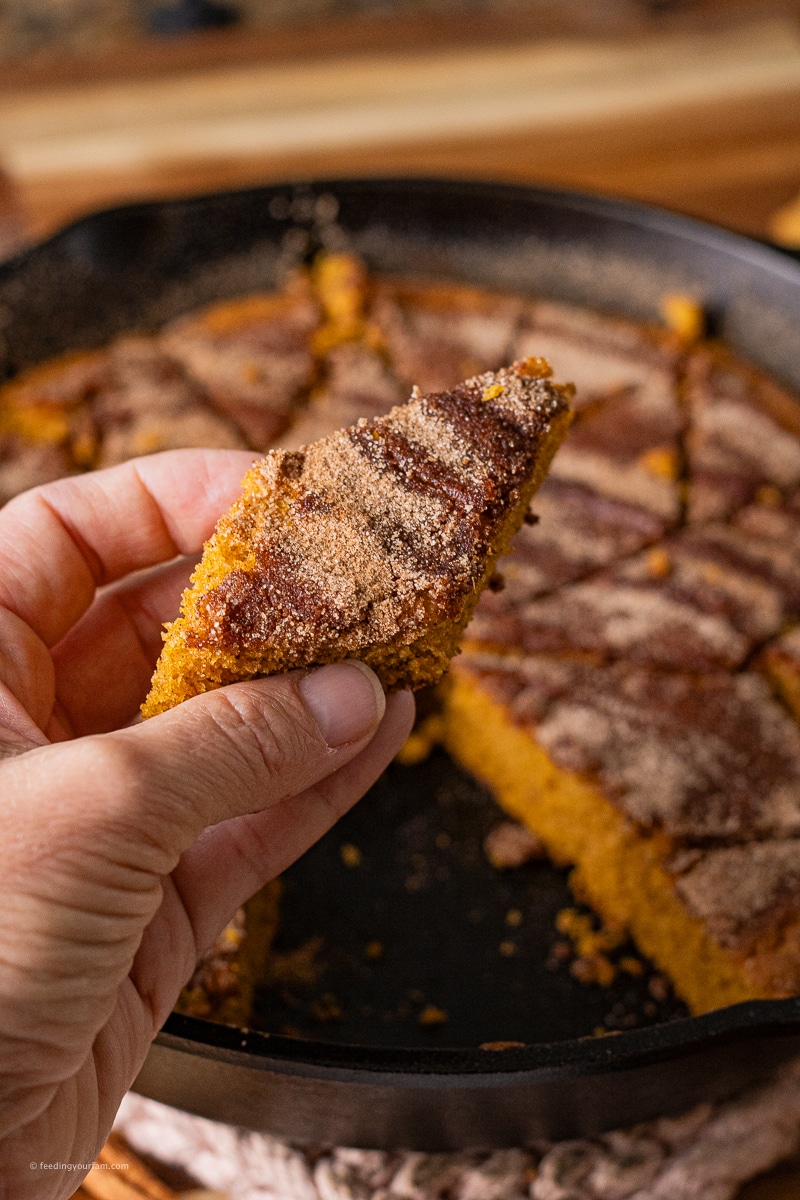 moist pumpkin spice bread slice with a cinnamon sugar topping